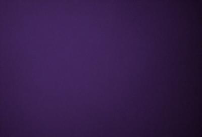 Purple background with no visible objects or textures.