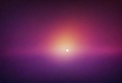 The primary subject of the image is a bright, glowing moon, which is the main focus of the scene. The moon is located in the middle of the image, and its light illuminates the surrounding area. The setting is a purple sky, which adds a unique and atmospheric backdrop to the scene. The visual style of the image is a combination of photo and digital art, creating a captivating and artistic representation of the moon in the sky. The colors and mood of the image are predominantly