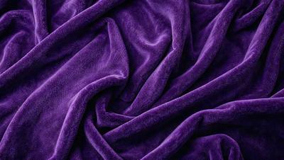 Purple blanket with a purple background.