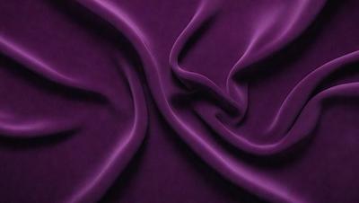 The primary subject of the image is a purple fabric, which is the main object, scene, or focus of the image. The setting or background is a purple sheet, and the visual style is a photo. The colors and mood of the image are predominantly purple, creating a calm and soothing atmosphere.