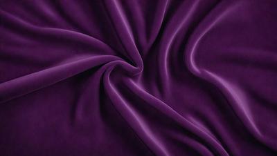 The primary subject of the image is a purple fabric, which is the main object, scene, or focus of the image. The setting or background is a purple sheet, and the visual style is a photo. The colors and mood of the image are predominantly purple, creating a calm and serene atmosphere.