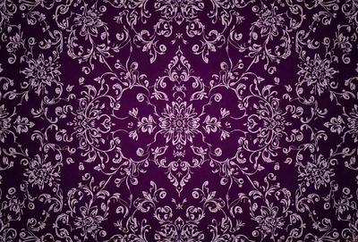 The primary subject of the image is a purple and white floral pattern, which is the main object, scene, or focus of the image. The setting is a purple and white floral patterned fabric, which serves as the backdrop or surface. The visual style of the image is a close-up of the floral pattern, showcasing the intricate details of the design. The colors and mood of the image are predominantly purple and white, creating a calm and elegant atmosphere.