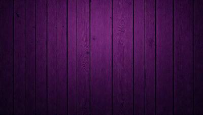 Purple wood paneling on a wall.