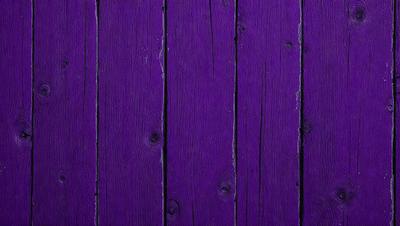 Purple wood paneling on a wall.