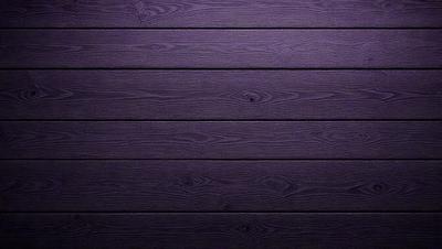 Purple wood paneling on a wall.