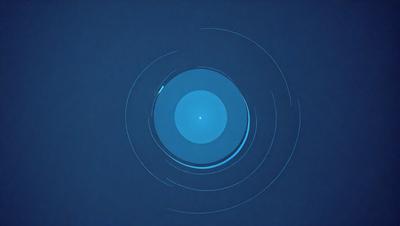 The primary subject of the image is a blue circle, which appears to be a circle of light or a blue circle with a dot in the center. The setting is a blue background, which complements the blue circle. The visual style of the image is a close-up of the blue circle, emphasizing its shape and color. The colors and mood of the image are predominantly blue, creating a calm and serene atmosphere.