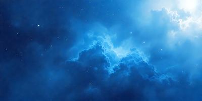 The primary subject of the image is a cloudy blue sky filled with clouds. The setting is a nighttime scene, with the sky being the main focus of the image. The visual style is a combination of a photo and digital art, creating a unique and artistic representation of the cloudy sky. The colors and mood of the image are predominantly blue, with a sense of tranquility and serenity.