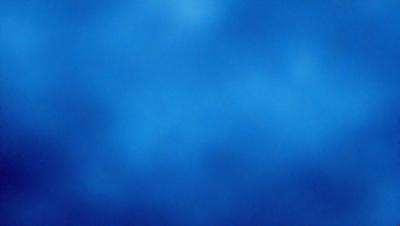 The primary subject of the image is a blue sky with clouds. The setting is a vast, open space with no visible landmarks or objects. The visual style is a natural, outdoor scene. The colors and mood are predominantly blue, creating a calm and serene atmosphere.