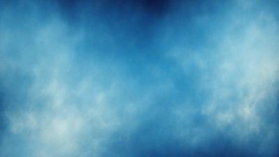 The primary subject of the image is a blue sky with clouds. The setting is a cloudy day, and the visual style is a photo. The dominant colors are blue and white, creating a calm and serene atmosphere.
