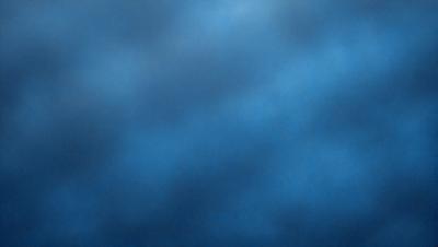 The primary subject of the image is a blue sky with clouds. The setting is a cloudy day, and the visual style is a photo. The dominant colors are blue and white, creating a calm and serene atmosphere.
