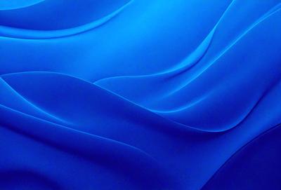 The primary subject of the image is a blue wave or ripple pattern, which is the main focus of the image. The setting or background consists of a blue surface, possibly a wall or a piece of fabric. The visual style of the image is a digital art or illustration, as it is a well-defined and detailed pattern. The dominant colors in the image are blue, creating a calm and soothing atmosphere.