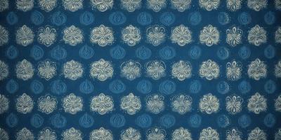 The primary subject of the image is a blue and white floral pattern. The setting is a blue background, and the visual style appears to be a combination of a photo and a digital art or illustration. The dominant colors are blue and white, creating a calm and serene atmosphere.