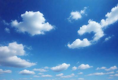The primary subject of the image is a cloudy blue sky filled with numerous white clouds. The setting is a vast, open sky, and the visual style is a natural, outdoor scene. The colors and mood of the image are predominantly blue and white, creating a serene and peaceful atmosphere.