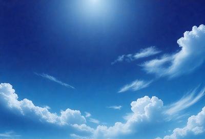 The primary subject of the image is the sky, which is filled with clouds. The setting is a clear blue sky, and the visual style is a photo. The colors in the image are predominantly blue and white, creating a serene and peaceful atmosphere.