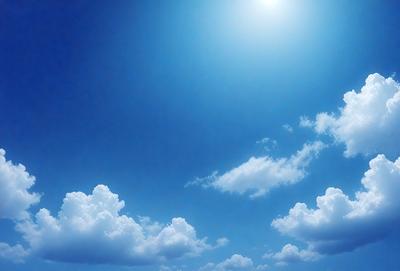 The primary subject of the image is a beautiful blue sky filled with fluffy white clouds. The setting is a clear day with no visible landmarks or objects. The visual style is a natural, outdoor scene with a serene atmosphere. The colors and mood are predominantly blue and white, creating a sense of calmness and tranquility.