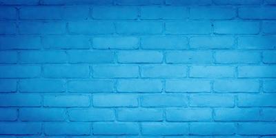 The primary subject of the image is a blue brick wall. The setting is a blue brick wall, and the visual style is a photo. The dominant colors are blue and white, creating a calm and serene atmosphere.