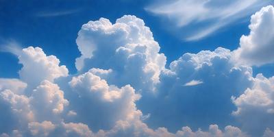 The primary subject of the image is a cloudy sky filled with large, fluffy clouds. The setting is a blue sky, which provides a contrasting background for the clouds. The visual style of the image is a photo, capturing the beauty of the cloudy sky. The colors and mood of the image are predominantly white and blue, creating a serene and peaceful atmosphere.