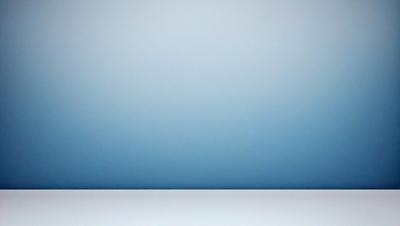 The primary subject of the image is a large, empty white wall. The setting is a room with a blue background, which adds a contrasting color to the scene. The visual style is a photo, capturing the stark contrast between the white wall and the blue background. The colors and mood of the image are predominantly white and blue, creating a clean and minimalist atmosphere.