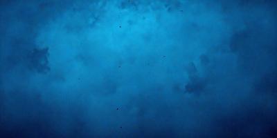 The primary subject of the image is a blue sky filled with white clouds. The setting is a cloudy sky, and the visual style is a photo. The dominant colors are blue and white, creating a calm and serene atmosphere.