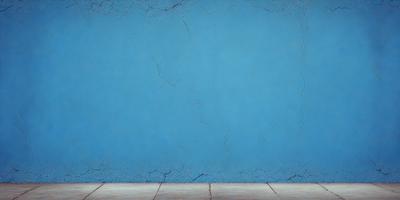 The primary subject of the image is a blue wall with a cracked and chipped appearance. The setting is a room with a wooden floor. The visual style is a photo, and the dominant colors are blue and white. The overall atmosphere is somewhat distressed and aged, possibly suggesting a vintage or aged aesthetic.
