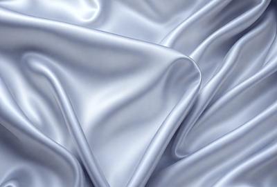 The primary subject of the image is a white sheet of fabric, which is the main object, scene, or focus of the image. The setting or background is a white sheet of fabric, and the visual style is a photo. The colors and mood of the image are predominantly white, giving it a clean and simple appearance.
