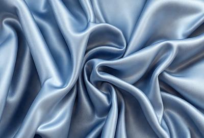 The primary subject of the image is a blue fabric, which is the main object, scene, or focus of the image. The setting or background is a blue cloth, and the visual style is a photo. The dominant colors and overall atmosphere are blue and serene.