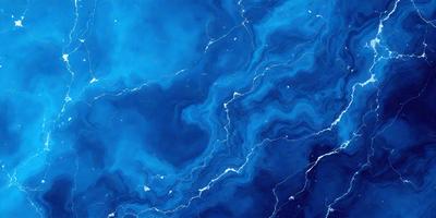 The primary subject of the image is a blue and white swirling pattern, which appears to be a digital art or illustration. The setting is a blue background, and the visual style is a combination of digital art and illustration. The dominant colors are blue and white, creating a calming and serene atmosphere.