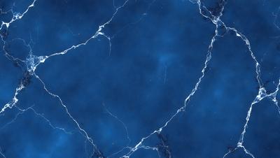 The primary subject of the image is a blue marble wall with a pattern of white veins. The setting is a room with a blue background, and the visual style is a close-up of the marble wall. The colors and mood of the image are predominantly blue, with the white veins adding a touch of contrast and interest to the overall atmosphere.