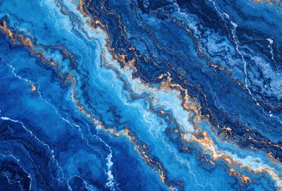 The primary subject of the image is a blue and gold swirling pattern, which appears to be a painting or a digital artwork. The setting is a blue and gold ocean, creating a serene and calming atmosphere. The visual style is a combination of painting and digital art, giving the image a unique and artistic appearance. The dominant colors are blue and gold, which contribute to the overall mood of the image, evoking a sense of tranquility and beauty.