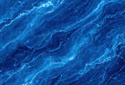 The primary subject of the image is a blue marble wall with a pattern of lightning bolts. The setting is a dark room, and the visual style is a close-up of the marble wall. The dominant colors are blue and white, creating a calm and serene atmosphere.
