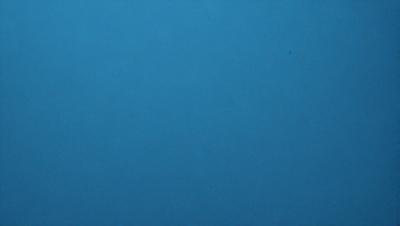 The primary subject of the image is a large, empty blue sky. The setting is a vast, open space with no visible landmarks or objects. The visual style is a simple, uncluttered representation of the sky. The colors and mood are predominantly blue, creating a calm and serene atmosphere.