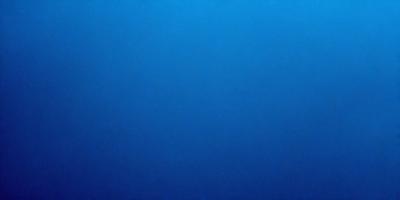 The primary subject of the image is a large body of blue water. The setting is a vast, open ocean with no visible land or other objects. The visual style is a realistic representation of the ocean, with no indication of digital manipulation or artistic elements. The colors and mood of the image are predominantly blue, creating a serene and tranquil atmosphere.