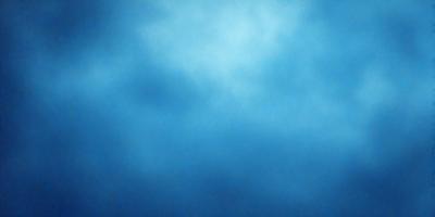 The primary subject of the image is a blue sky with clouds. The setting is a cloudy day, and the visual style is a natural, outdoor scene. The colors and mood of the image are predominantly blue, creating a calm and serene atmosphere.