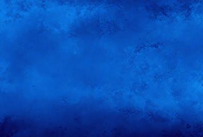The primary subject of the image is a blue background with a few white clouds. The setting is a blue sky, and the visual style is a photo. The colors and mood of the image are predominantly blue and calm, creating a serene atmosphere.