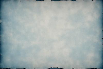 The primary subject of the image is a white sheet of paper. The setting is a cloudy sky, which serves as the backdrop for the paper. The visual style is a combination of a photo and a drawing, giving the image a unique and artistic appearance. The colors and mood of the image are predominantly white and cloudy, creating a calm and serene atmosphere.