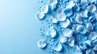 The primary subject of the image is a close-up of white flowers, likely petals, floating on a blue surface. The setting appears to be a blue background, which adds to the overall mood of the image. The visual style of the image is a close-up of the flowers, showcasing their details and texture. The colors in the image are predominantly blue and white, creating a serene and calming atmosphere.