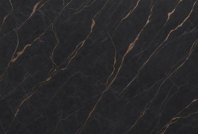 The primary subject of the image is a close-up of a marble countertop. The setting is a kitchen, with the countertop being the main focus of the scene. The visual style is a photo, capturing the natural texture and patterns of the marble. The colors and mood of the image are predominantly black and brown, giving it a sophisticated and elegant appearance.