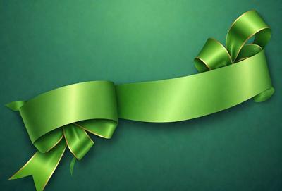 The primary subject of the image is a green ribbon. The ribbon is tied in a bow and is placed on a green background. The visual style of the image is a photo, and the colors and mood are predominantly green, creating a calm and serene atmosphere.