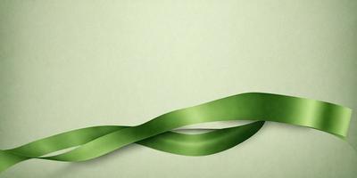 The primary subject of the image is a green ribbon or strip, which is the main focus of the image. The ribbon is winding around a surface, possibly a wall or a green background. The visual style of the image is a close-up of the green ribbon, which gives it a prominent and detailed appearance. The colors and mood of the image are predominantly green, creating a calm and soothing atmosphere.