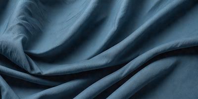 The primary subject of the image is a blue fabric, which is the main object, scene, or focus of the image. The setting or background is a blue cloth, and the visual style is a photo. The dominant colors and overall atmosphere are blue and calm.
