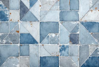 The primary subject of the image is a blue and white tile pattern. The setting is a blue and white tile floor, which is the main object, scene, or focus of the image. The visual style is a pattern, and the colors and mood are predominantly blue and white, creating a clean and modern atmosphere.