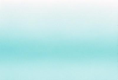 The primary subject of the image is a large body of water, which appears to be a vast ocean. The setting is a clear blue sky, creating a serene and peaceful atmosphere. The visual style of the image is a photo, capturing the beauty of the ocean and the sky. The colors and mood of the image are predominantly blue, which adds to the calming and tranquil ambiance.
