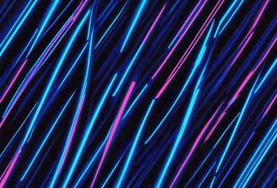 The primary subject of the image is a pattern of blue and pink stripes. The setting is a dark background, which contrasts with the bright colors of the stripes. The visual style appears to be a digital art or illustration, as the stripes are depicted in a clean and organized manner. The colors and mood of the image are vibrant and energetic, with the blue and pink stripes creating a lively and dynamic atmosphere.