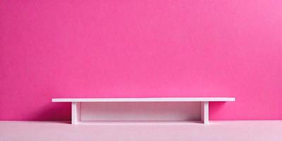 The primary subject of the image is a pink wall. The setting is a room with a pink wall, and the visual style is a photo. The dominant colors in the image are pink, and the overall atmosphere is warm and inviting.