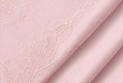 The primary subject of the image is a piece of pink lace, which is the main focus of the image. The setting is a pink background, and the visual style is a close-up of the lace. The colors and mood of the image are predominantly pink, creating a soft and delicate atmosphere.