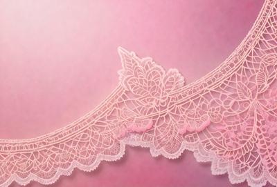 The primary subject of the image is a lace trimmed with pink fabric. The setting is a pink background, which creates a contrast with the lace and fabric. The visual style is a close-up of the lace, showcasing its intricate design. The colors and mood of the image are predominantly pink, giving it a delicate and feminine appearance.