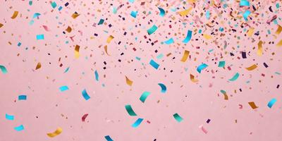 The primary subject of the image is a pink background with a variety of colorful confetti falling on it. The confetti consists of different shapes, sizes, and colors, creating a visually appealing and festive atmosphere. The setting appears to be a celebration or a special event, as the confetti is falling on the pink background, which could be a tablecloth or a wall. The visual style of the image is a combination of photo and digital art, as the confetti appears to be falling in a controlled manner
