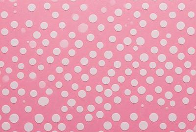 The primary subject of the image is a pattern of white dots on a pink background. The dots are arranged in a visually appealing manner, creating a sense of depth and texture. The setting is a pink surface, which adds a warm and inviting atmosphere to the scene. The visual style of the image is a combination of digital art and illustration, as the dots are carefully placed and the overall composition is well-executed. The colors and mood of the image are predominantly pink and warm,