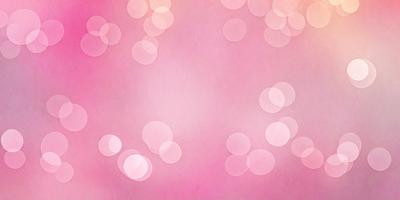 The primary subject of the image is a pink background with a pattern of white circles. The setting is a pink background with a pattern of white circles. The visual style is a pink background with a pattern of white circles. The colors and mood are predominantly pink and white, creating a warm and inviting atmosphere.