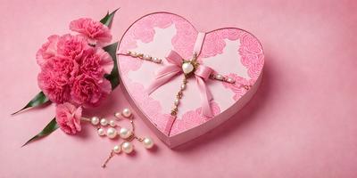 The primary subject of the image is a pink heart-shaped box with a bow on top, containing pearls. The setting is a pink background, and the visual style is a photo. The colors and mood of the image are predominantly pink, creating a warm and romantic atmosphere.
